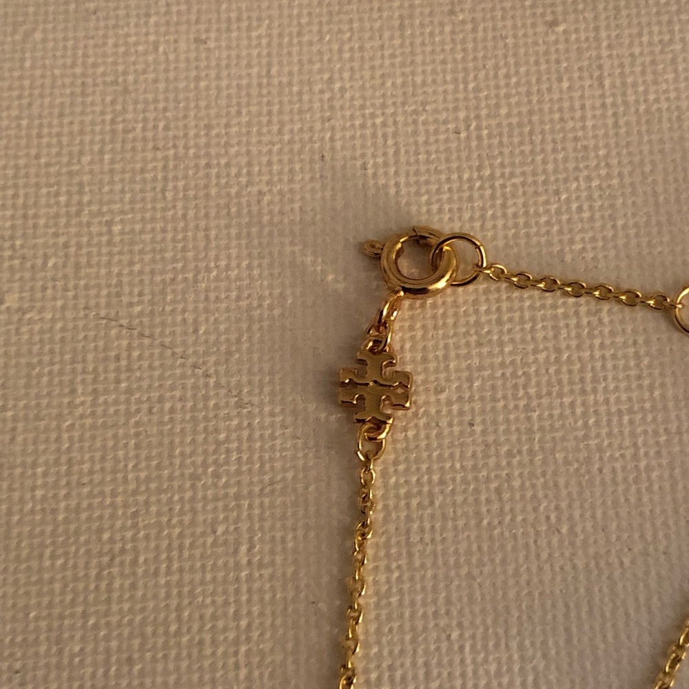 Tory Burch Gold and White Flower Charm Bracelet - Picture 4 of 6